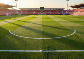 Vast green pitch and grandstands of Camp Nou stadium in Barcelona